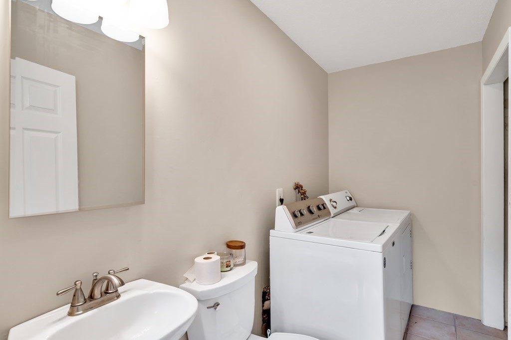 184 West Acton Road Stow, MA 01775 - Photo 25 of 35 a bathroom with a sink mirror and toilet