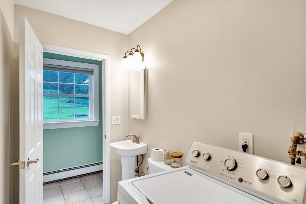 184 West Acton Road Stow, MA 01775 - Photo 27 of 35 a bathroom with a toilet sink and mirror