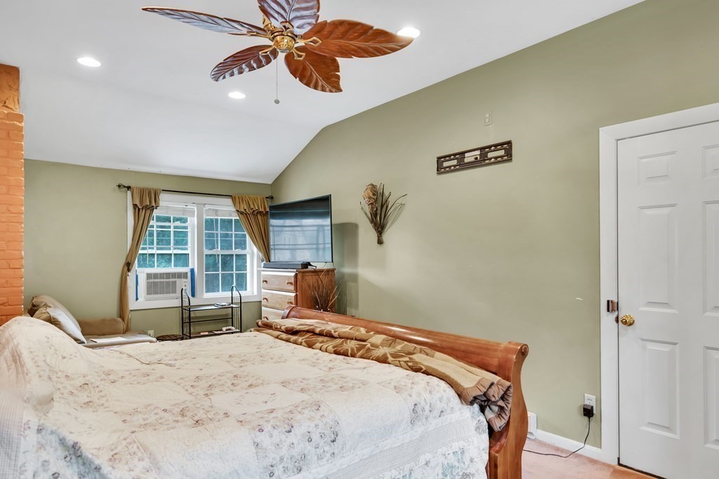 184 West Acton Road Stow, MA 01775 - Photo 28 of 35 a bedroom with a bed and a window