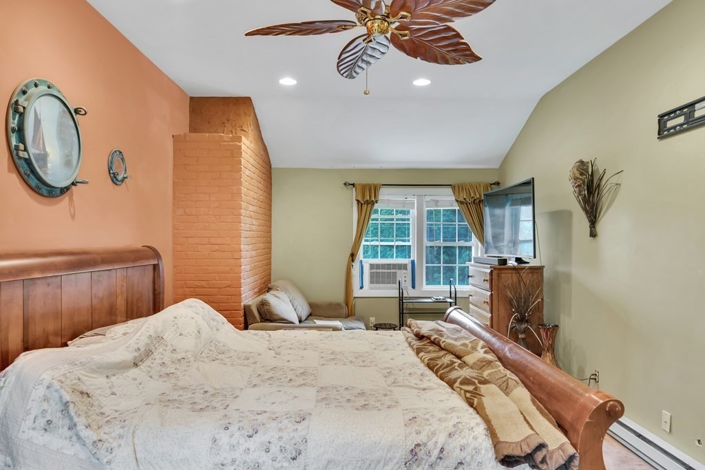 184 West Acton Road Stow, MA 01775 - Photo 29 of 35 a bedroom with a large bed and a window