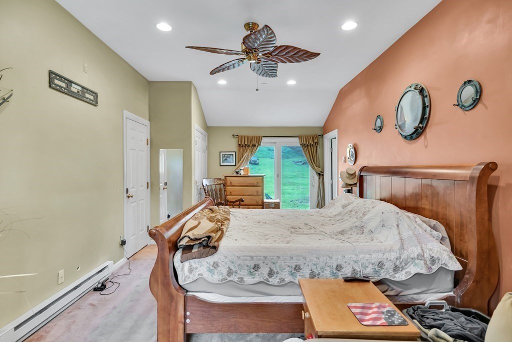 184 West Acton Road Stow, MA 01775 - Photo 30 of 35 a living room with furniture and a chandelier