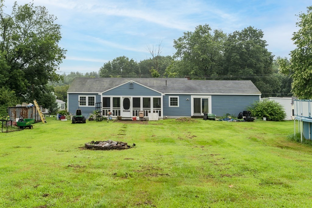 184 West Acton Road Stow, MA 01775 - Photo 33 of 35 a front of a house with a garden