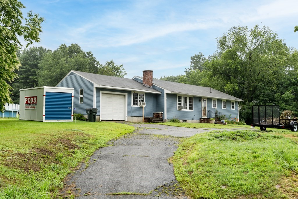 184 West Acton Road Stow, MA 01775 - Photo 35 of 35 a front view of a house with a garden and trees