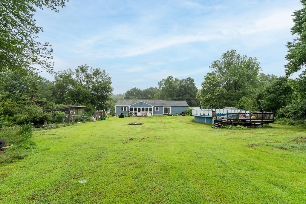 184 West Acton Road Stow, MA 01775 - Photo 5 of 35 a swimming pool with outdoor seating and yard