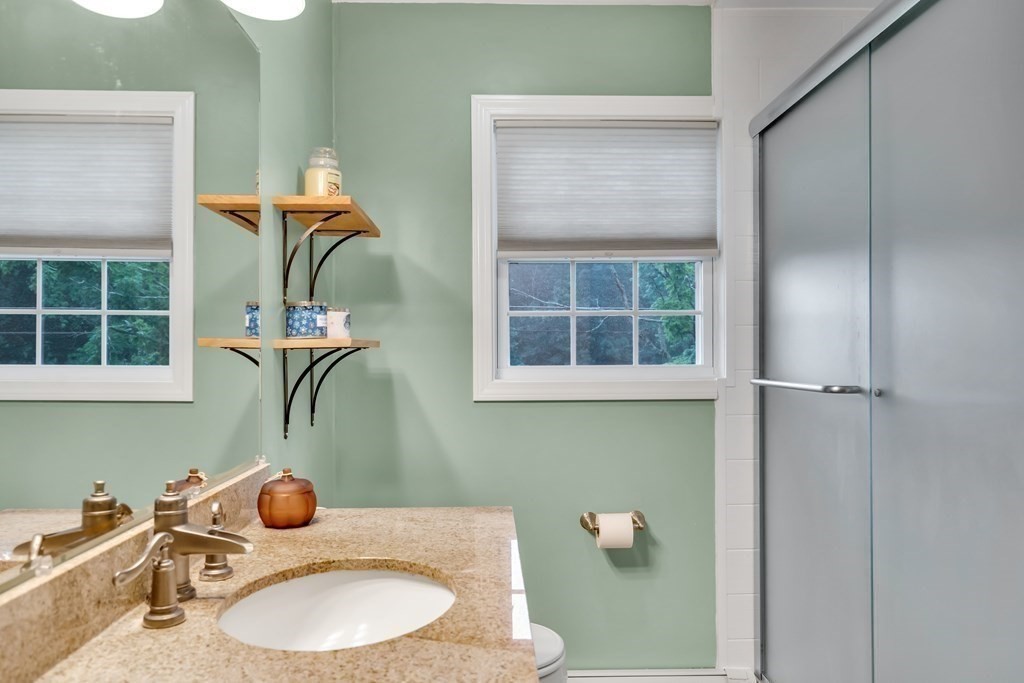 184 West Acton Road Stow, MA 01775 - Photo 6 of 35 a bathroom with a sink a toilet and a mirror