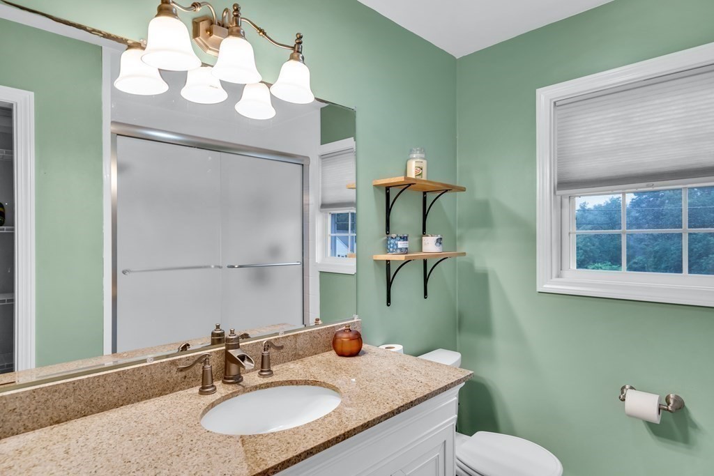 184 West Acton Road Stow, MA 01775 - Photo 7 of 35 a bathroom with a granite countertop sink and a mirror
