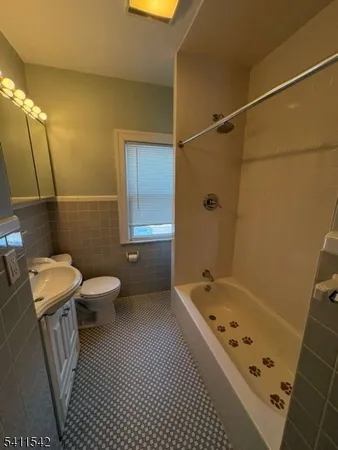a bathroom with a bathtub and toilet