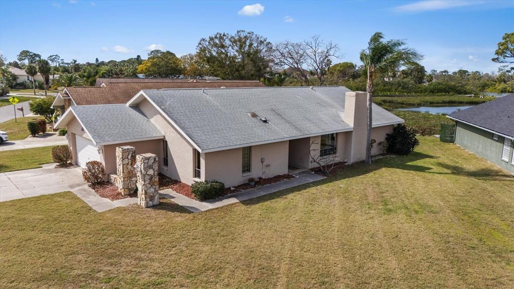 4513 Dewey Drive New Port Richey, FL 34652 - Photo 1 of 1 a view of a house with yard and sitting area