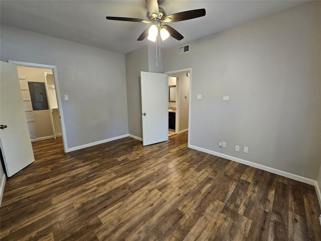 8601 Park Lane, Unit 522 Dallas, TX 75231 - Photo 16 of 21 a view of an empty room and wooden floor