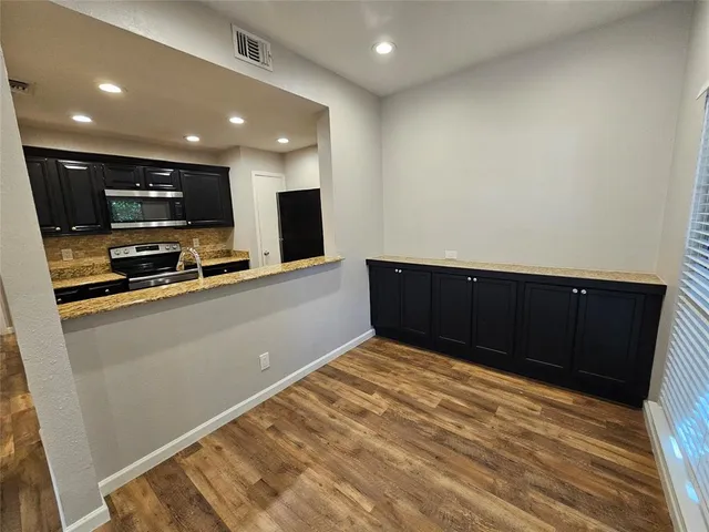 a view of kitchen with wooden floor