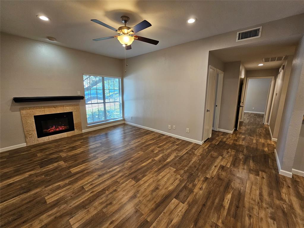 8601 Park Lane, Unit 522 Dallas, TX 75231 - Photo 8 of 21 a view of an empty room with a fireplace and a window