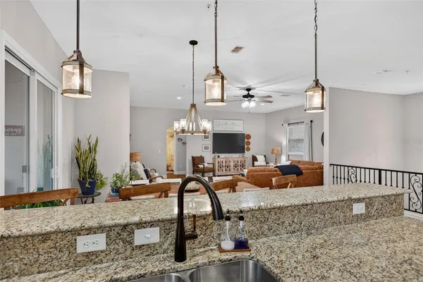 a view of a living room and chandelier