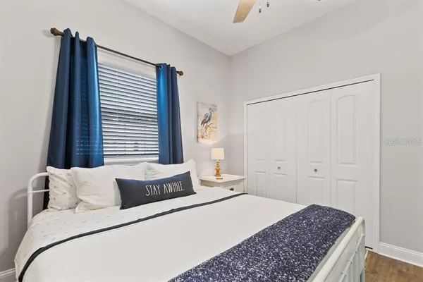 a bedroom with a bed and a window