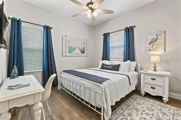 a bedroom with a bed and a table in it