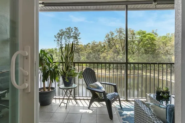 a view of a chairs and table in the balcony