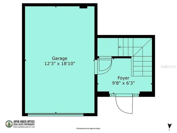 a view of a lake with houses in the back