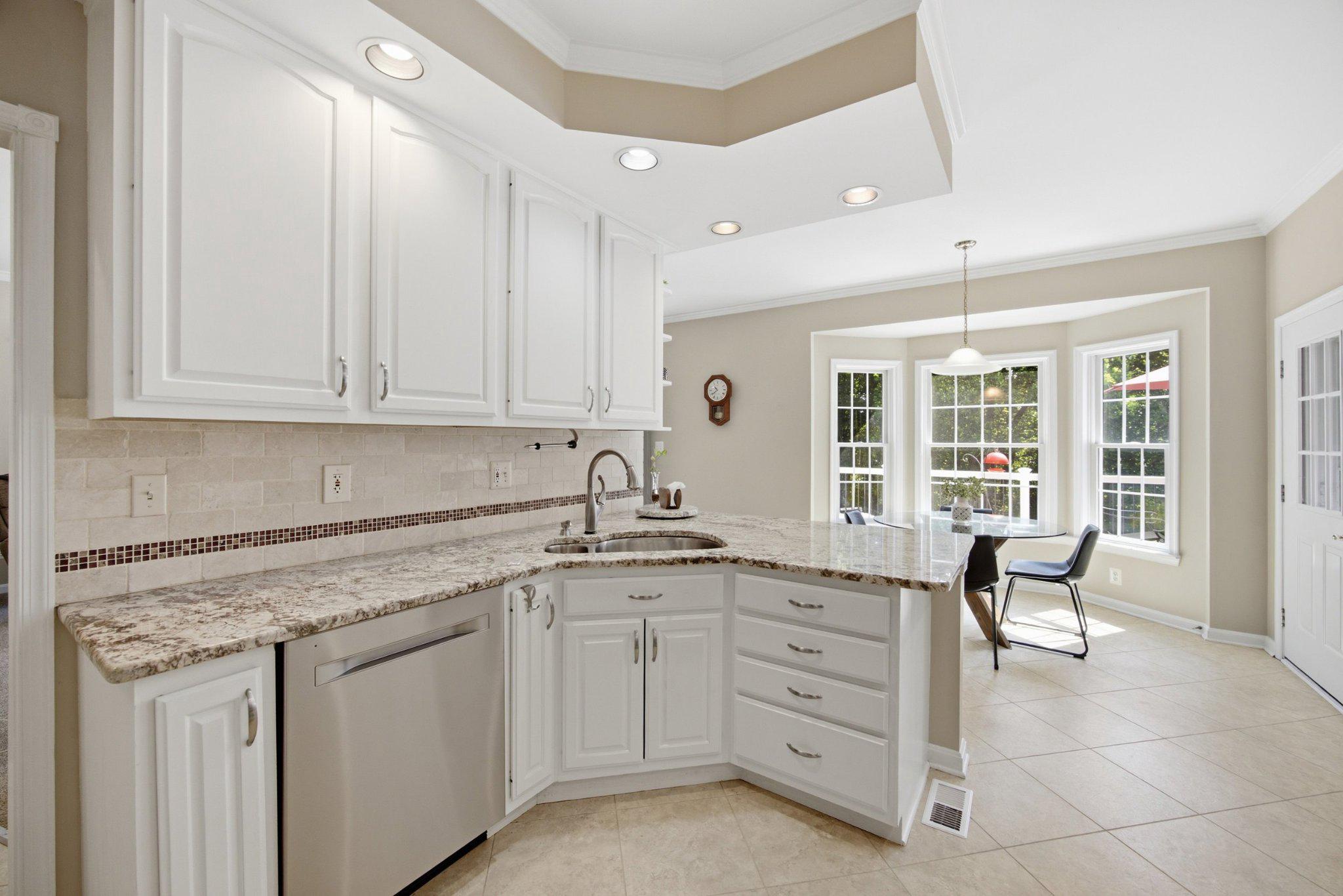 3723 Bay Road Street, MD 21154 - Photo 8 of 57 Sink overlooks breakfast nook and deck beyond