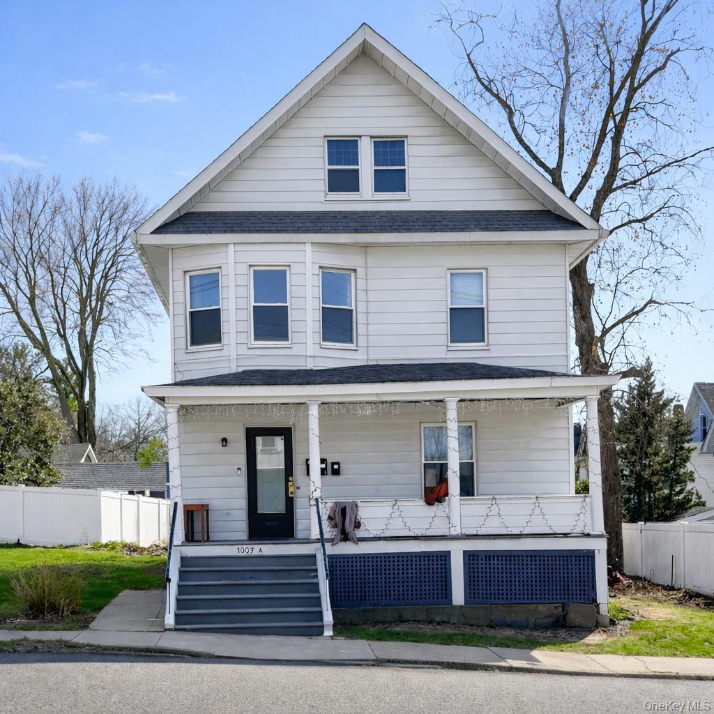 1009 Hudson Avenue, Unit 1S Peekskill, NY 10566 - Photo 1 of 21 a front view of a house with a porch