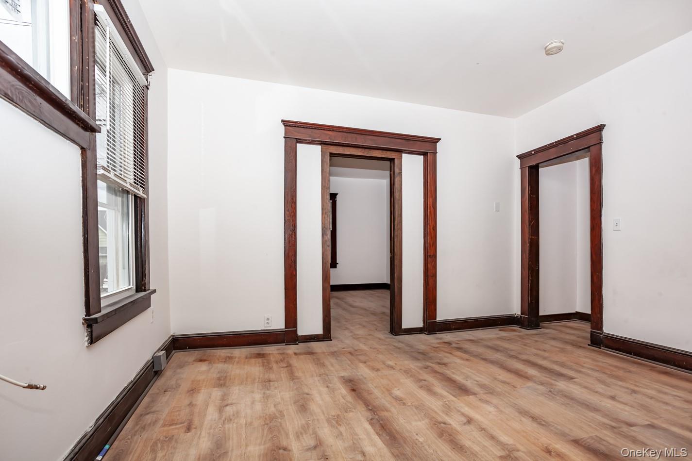 1009 Hudson Avenue, Unit 1S Peekskill, NY 10566 - Photo 14 of 21 a view of empty room with wooden floor and fan