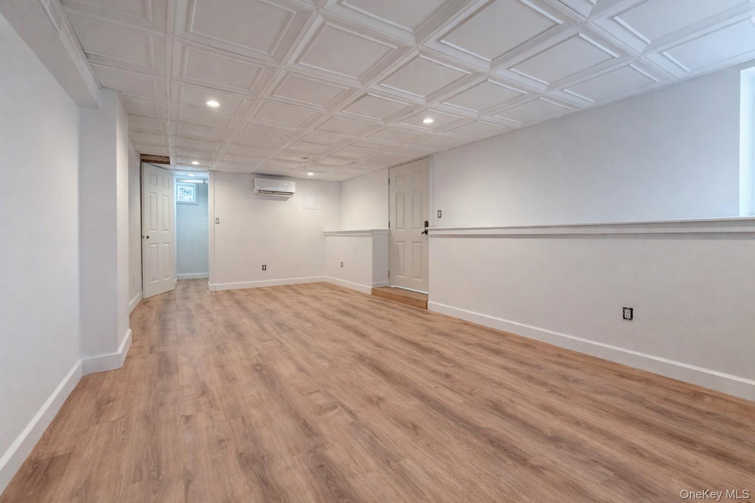 1009 Hudson Avenue, Unit 1S Peekskill, NY 10566 - Photo 17 of 21 a view of empty room with wooden floor