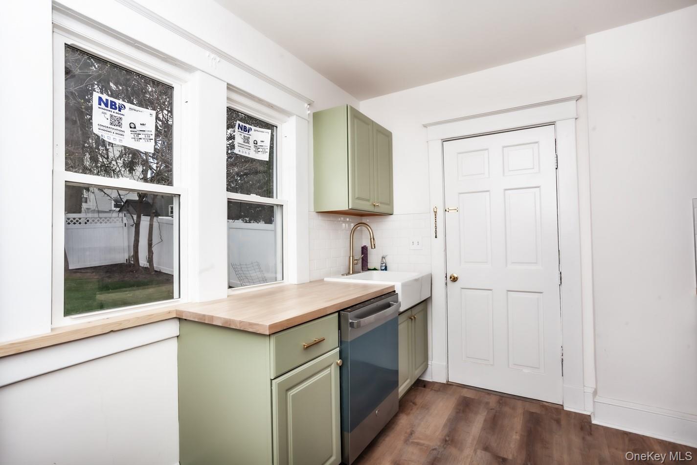 1009 Hudson Avenue, Unit 1S Peekskill, NY 10566 - Photo 5 of 21 a kitchen with a sink and a refrigerator