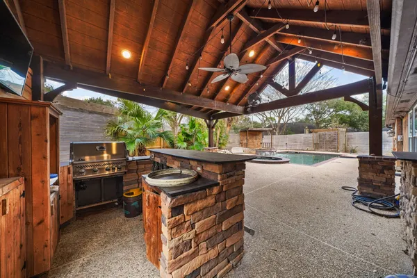 a view of a swimming pool with a patio