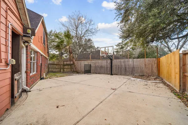 a view of a house with backyard porch and sitting area