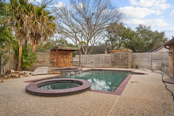 a view of house with outdoor space and sitting area