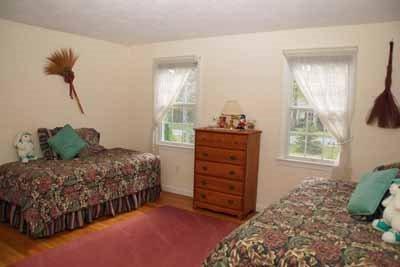 8 Dundee Circle Harwich, MA 02645 - Photo 13 of 28 a bedroom with a bed and a window