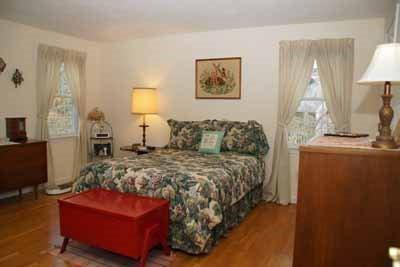 8 Dundee Circle Harwich, MA 02645 - Photo 16 of 28 a bedroom with a bed and wooden floor
