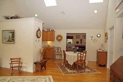 8 Dundee Circle Harwich, MA 02645 - Photo 19 of 28 a view of a dining room with furniture and wooden floor