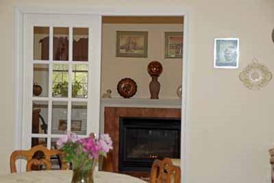 8 Dundee Circle Harwich, MA 02645 - Photo 20 of 28 a living room with furniture and a fireplace