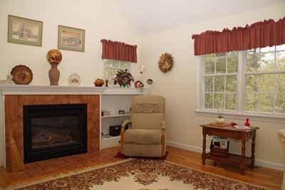 8 Dundee Circle Harwich, MA 02645 - Photo 23 of 28 a living room with furniture and a fireplace