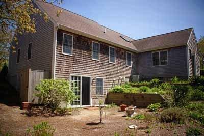 8 Dundee Circle Harwich, MA 02645 - Photo 3 of 28 a front view of a house with a yard