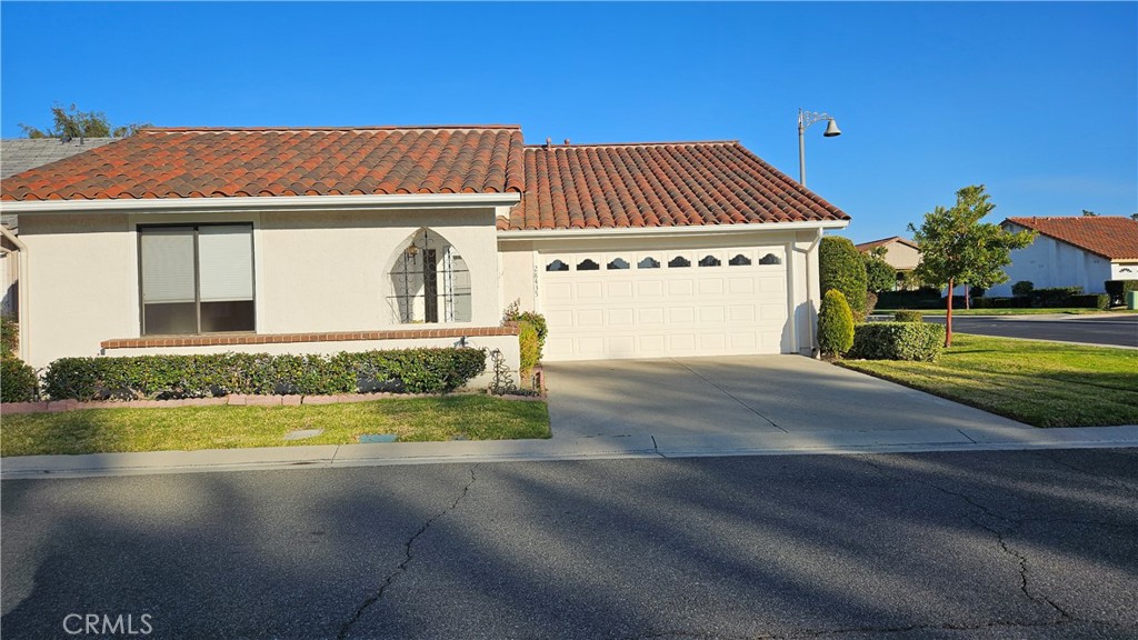 28435 Barbosa Mission Viejo, CA 92692 - Photo 1 of 21 a front view of a house with a garden