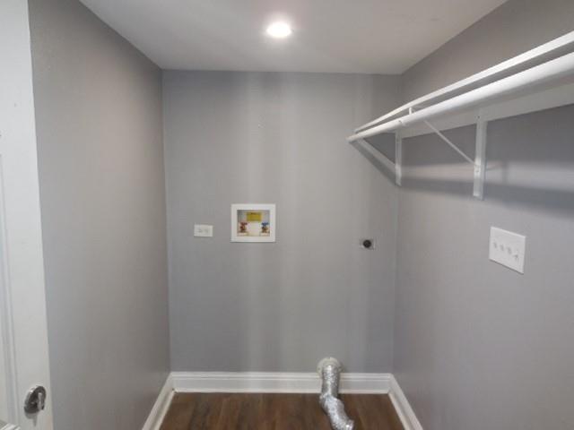127 Stonewall-Preston Road Stonewall, LA 71078 - Photo 15 of 19 Laundry room with hookup for an electric dryer, dark wood-style flooring, baseboards, hookup for a washing machine, and laundry area