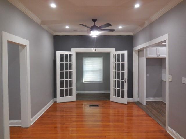 127 Stonewall-Preston Road Stonewall, LA 71078 - Photo 4 of 19 Unfurnished room featuring baseboards, recessed lighting, wood finished floors, ceiling fan, and crown molding