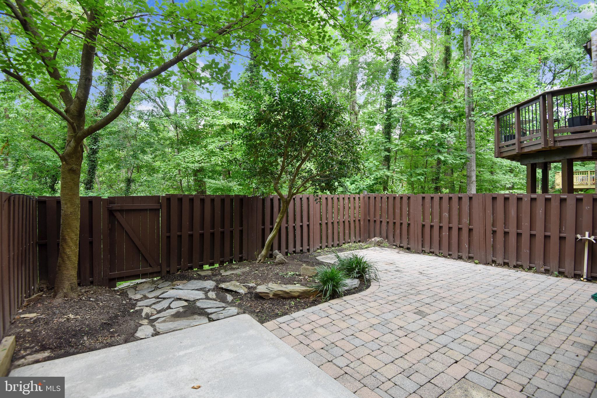 11077 Saffold Way Reston, VA 20190 - Photo 26 of 30 Fenced Rear with Patio Backing to Trees