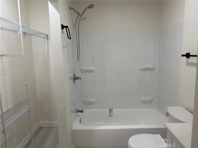 a bathroom with a bathtub and shower