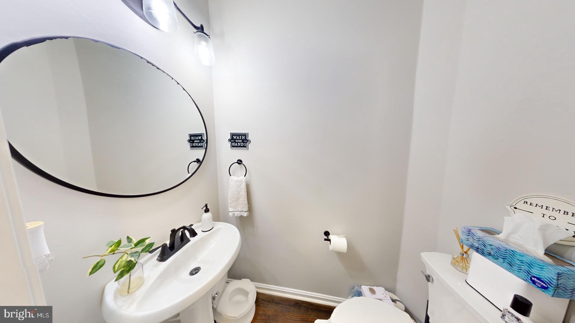 25405 Chicama Drive Chantilly, VA 20152 - Photo 17 of 44 a bathroom with a sink mirror and toilet