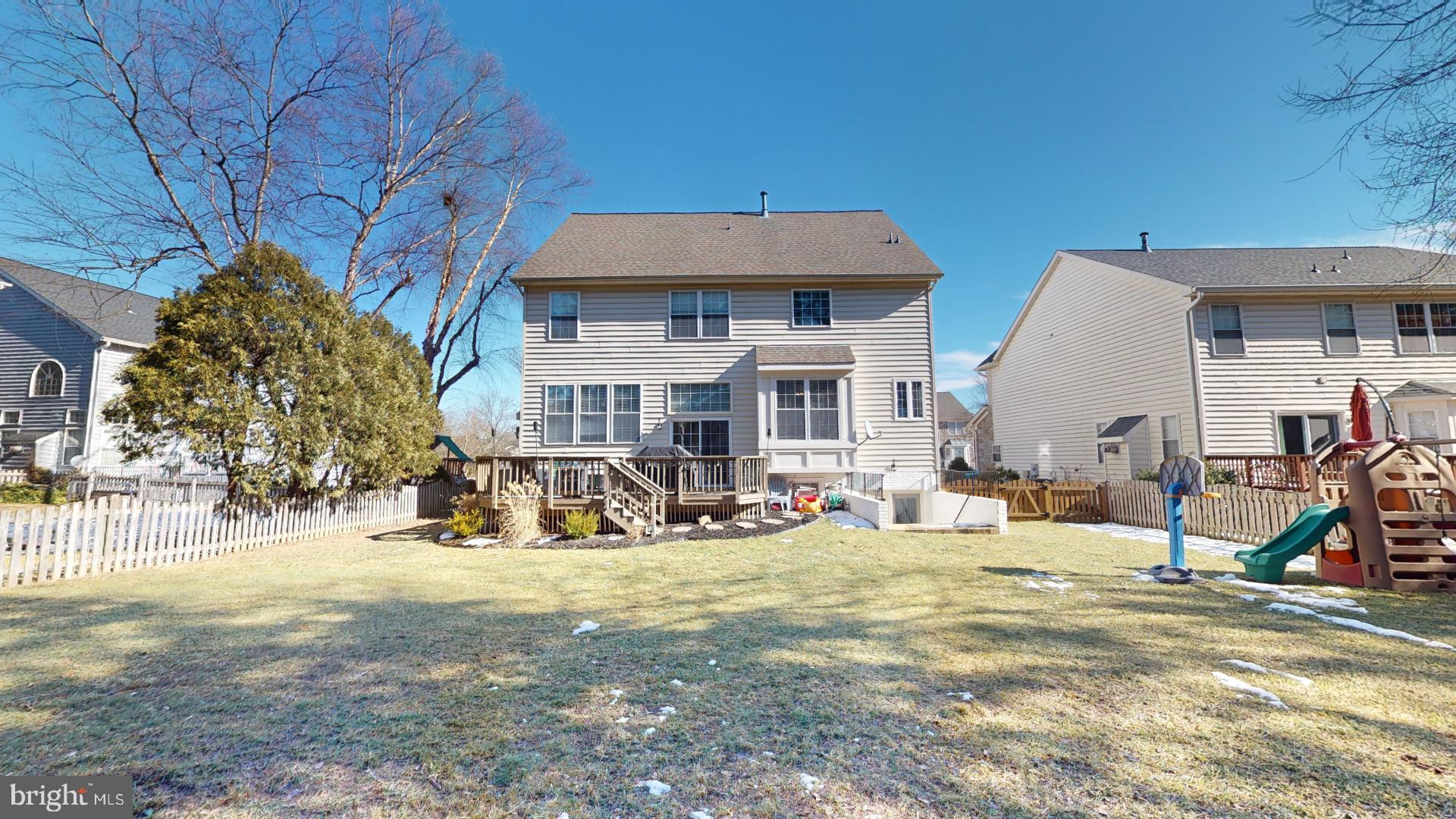 25405 Chicama Drive Chantilly, VA 20152 - Photo 42 of 44 a view of a house with a yard patio and fire pit