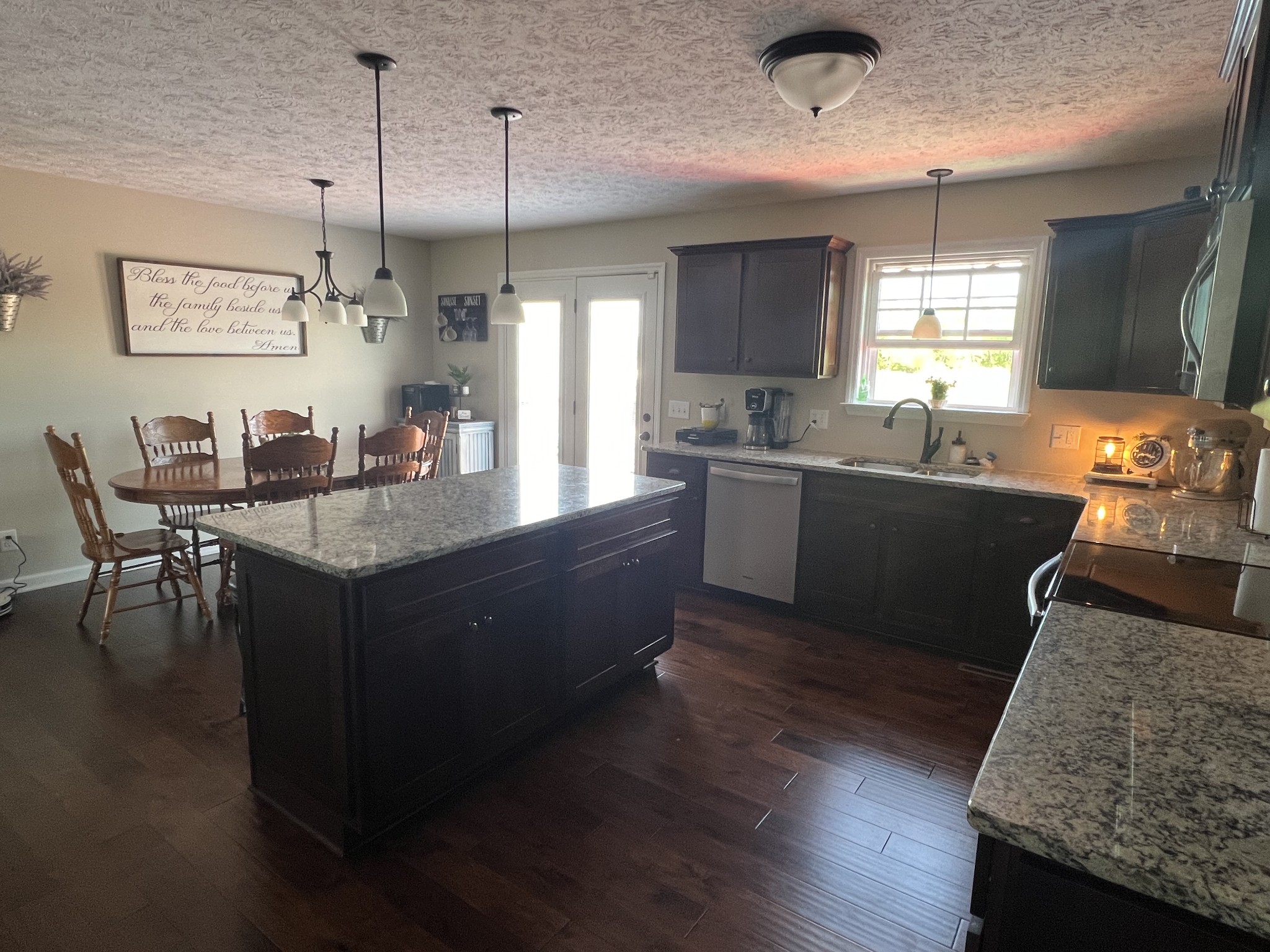 546 Corinth Road Portland, TN 37148 - Photo 19 of 37 a kitchen with granite countertop stove sink and cabinets