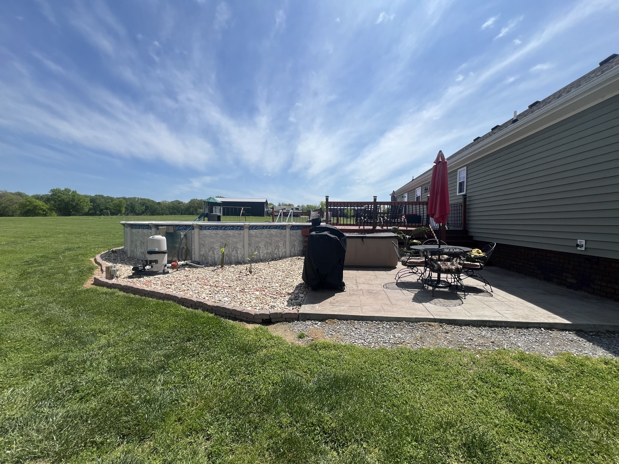 546 Corinth Road Portland, TN 37148 - Photo 8 of 37 a view of a backyard with chairs and plants