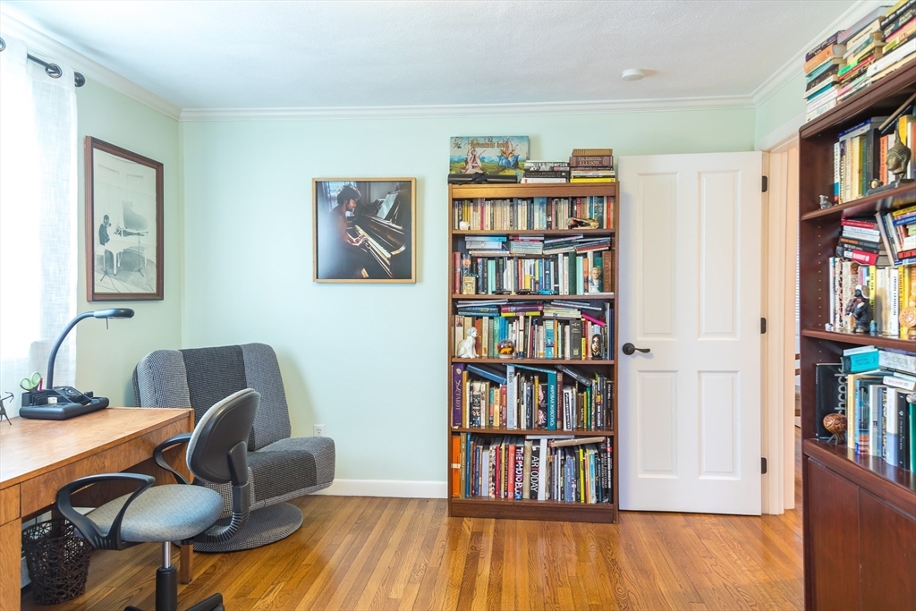 15 Higgins Road Marblehead, MA 01945 - Photo 12 of 26 a view of a workspace with furniture and book shelf