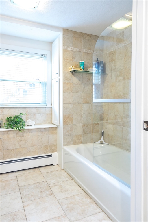 15 Higgins Road Marblehead, MA 01945 - Photo 21 of 26 a bathroom with a bathtub and a shower