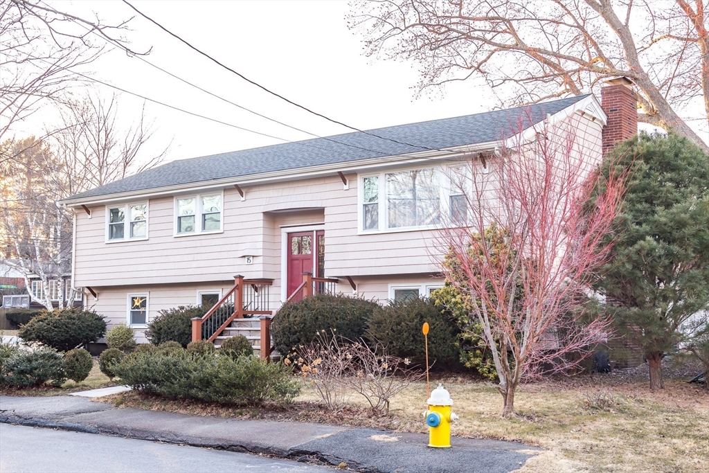 15 Higgins Road Marblehead, MA 01945 - Photo 25 of 26 a front view of a house with a garden