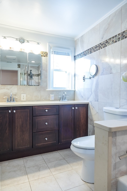 15 Higgins Road Marblehead, MA 01945 - Photo 7 of 26 a bathroom with a granite countertop sink a toilet and a mirror