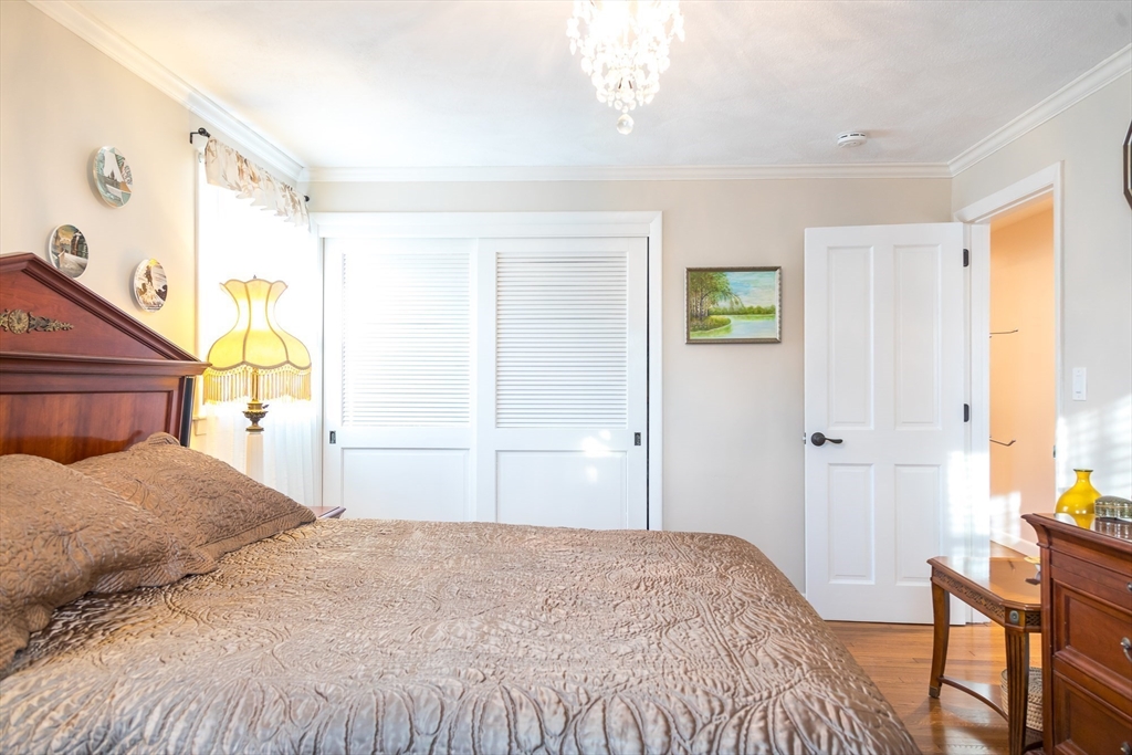 15 Higgins Road Marblehead, MA 01945 - Photo 10 of 26 a bedroom with a bed and a window