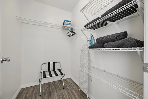 a view of a hardwood floor and staircase