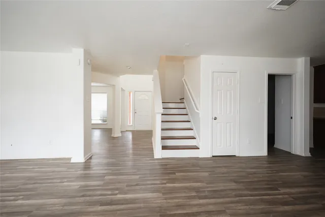 a view of entryway with wooden floor